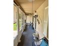 Cozy screened-in porch perfect for relaxing with outdoor furniture and natural light at 4145 Se 3Rd St, Ocala, FL 34471