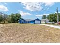 Charming blue single-story home with a two-car garage in a quiet neighborhood at 6570 Sw 129Th Loop, Ocala, FL 34473