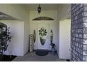 Charming front entrance with a decorative door, sidelights, and brick pillar at 9129 Sw 193Rd Cir, Dunnellon, FL 34432