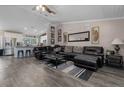 Comfortable living room featuring an open concept layout, plank flooring and neutral paint at 11806 Sw 61St Place Rd, Ocala, FL 34481