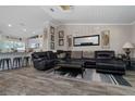 Comfortable living room featuring an open concept layout, plank flooring and neutral paint at 11806 Sw 61St Place Rd, Ocala, FL 34481