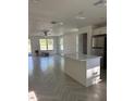 Bright kitchen featuring a center island with quartz countertops and stainless steel appliances at 14173 Se 41St Ter, Summerfield, FL 34491