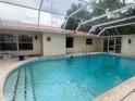 A bright, screened in pool offers outdoor enjoyment at 16850 Se 19Th Ct, Summerfield, FL 34491