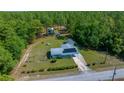 An aerial view of the property and neighborhood, showing the home and its nicely sized lot at 23737 Nw Mallard Ave, Dunnellon, FL 34431