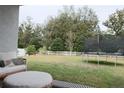 Expansive backyard with lush green grass and a privacy fence, perfect for outdoor activities at 5515 Se 91St St, Ocala, FL 34480