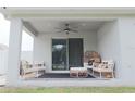 Covered patio furnished with comfortable seating, ideal for relaxing and entertaining guests at 5515 Se 91St St, Ocala, FL 34480