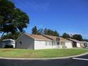 Residential home on a corner lot with a well-maintained lawn, mature landscaping and a view of neighboring homes at 13816 Sw 112Th Ter, Dunnellon, FL 34432