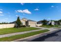 This single-story home features a well-maintained lawn, attached two-car garage, and serene neighborhood views at 1509 Ne 50Th Ter, Ocala, FL 34470