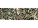An aerial view showing the home's placement on a large lot surrounded by trees at 20386 Sw 95Th St, Dunnellon, FL 34431