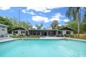 Backyard featuring a refreshing private pool and outdoor seating area perfect for entertaining at 4710 Se 30Th Ct, Ocala, FL 34480