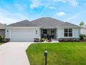 Charming single-story home featuring a welcoming front porch and neatly kept lawn at 4743 Nw 11Th Ct, Ocala, FL 34475