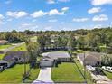Aerial of a single-story home highlighting the property lines and surrounding neighborhood at 6730 Cherry Rd, Ocala, FL 34472