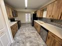 Kitchen featuring vintage-style cabinets, stainless steel appliances, and granite-look counters at 8654 Sw 96Th St # D, Ocala, FL 34481