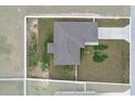 An aerial view of the house showcasing its layout, surrounding landscape, and fenced-in backyard at 9 Walnut Run, Ocala, FL 34480