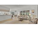 Bright and airy living room featuring large windows and an open concept design at 9565 Sw 194Th Cir, Dunnellon, FL 34432