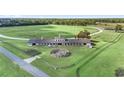 Aerial view of horse barn, training pen, and pastureland at Lot 8,9,10 Ne 155Th Pl, Citra, FL 32113