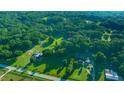 Aerial shot of property surrounded by mature trees, showcasing its vast and private setting at 13232 Ne 39Th Ter, Anthony, FL 32617