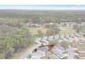 Aerial view of a neighborhood, showcasing surrounding trees at 13618 Sw 111Th Cir, Dunnellon, FL 34432