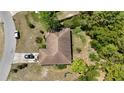 Birds eye view of a single story home with a brown roof and a black car in the driveway at 15920 Sw 49Th Court Rd, Ocala, FL 34473