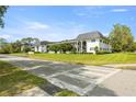 Exterior view of the charming condo building with well-maintained landscaping and manicured bushes at 1640 Ne 40Th Ave # 107, Ocala, FL 34470