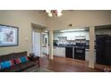 Inviting living area open to the kitchen with a comfortable couch and ample natural light at 20820 River Dr # B32, Dunnellon, FL 34431
