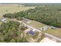Desirable aerial view of home with stunning green space surrounding property at 23131 Sw Rainelle Rd, Dunnellon, FL 34431