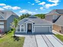 Beautiful single-story home with a well-manicured lawn and inviting curb appeal at 2525 Sand Arbor Cir, Orlando, FL 32824