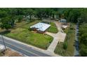 Expansive lot with fenced yard, screened pool, and detached garage provides a private retreat at 3934 Se 110Th St, Belleview, FL 34420