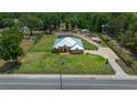 Sprawling property features a residence, fenced yard, and a generous driveway at 3934 Se 110Th St, Belleview, FL 34420