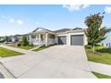 Lovely single-story home showcasing a spacious driveway and well-maintained lawn at 6342 Sw 77Th Ave, Ocala, FL 34474