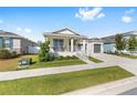 Attractive single-story home with a quaint front porch and a two-car garage at 6342 Sw 77Th Ave, Ocala, FL 34474