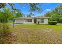 Charming single story home with a two car garage and well-maintained front yard at 8130 Sw 209Th Court Rd, Dunnellon, FL 34431