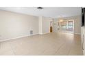 Bright living room featuring tile flooring and sliding glass doors to the lanai at 8130 Sw 209Th Court Rd, Dunnellon, FL 34431