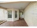 Covered entry featuring stone accents and a front door at 9093 Sw 91St Cir, Ocala, FL 34481