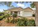 Well-maintained single-story home with lush landscaping at 9093 Sw 91St Cir, Ocala, FL 34481