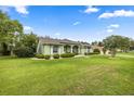 Beautiful home with a large front lawn and mature landscaping at 4966 Sw 107Th Loop, Ocala, FL 34476