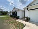 Beautiful single-story home with lush landscaping and a well-maintained lawn, creating a welcoming curb appeal at 12 Hickory Course Way, Ocala, FL 34472