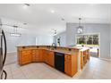 Spacious kitchen features a breakfast bar, and granite countertops perfect for entertaining guests at 17902 Se 115Th Cir, Summerfield, FL 34491