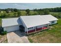 Expansive property featuring a bright home with a metal roof and beautiful surrounding land at 258 Nw 122Nd Ave, Oxford, FL 34484