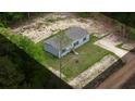 Aerial view of home, set on a spacious lot surrounded by lush greenery at 16231 Sw 20Th Ln, Ocala, FL 34481