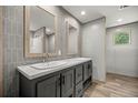 Stylish bathroom with a double vanity, sleek mirrors, and modern fixtures at 16231 Sw 20Th Ln, Ocala, FL 34481