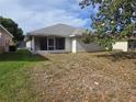 View of screened-in porch and backyard at 17974 Se 115Th Cir, Summerfield, FL 34491