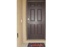 A secure brown front door provides a welcoming entrance and home security at 356 Se 66Th Ct, Ocala, FL 34472