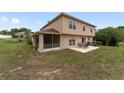 Backyard view featuring a screened porch and patio furniture at 4620 Sw 42Nd St, Ocala, FL 34474