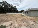 Large backyard featuring a white fence at 5359 Nw 55Th Pl, Ocala, FL 34482