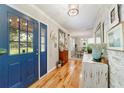 Inviting entryway showcasing wood floors, decorative accents, and a glimpse into the dining area at 5521 Sw 31St St, Ocala, FL 34474
