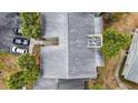 An aerial view showcases the complex's roof, landscaping, parking, and outdoor seating area at 559 Fairway Circle # A, Ocala, FL 34472