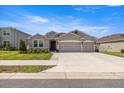 Charming single-story home with a well-manicured lawn and a two-car garage at 5862 Sw 80Th Ln, Ocala, FL 34476