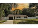 Lovely single-story home featuring a neatly manicured lawn and long driveway at 9 Pine Radial Ct, Ocala, FL 34472