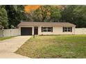 Cozy single-Gathering home with a manicured lawn, a private drive, and lovely curb appeal at 9 Pine Radial Ct, Ocala, FL 34472